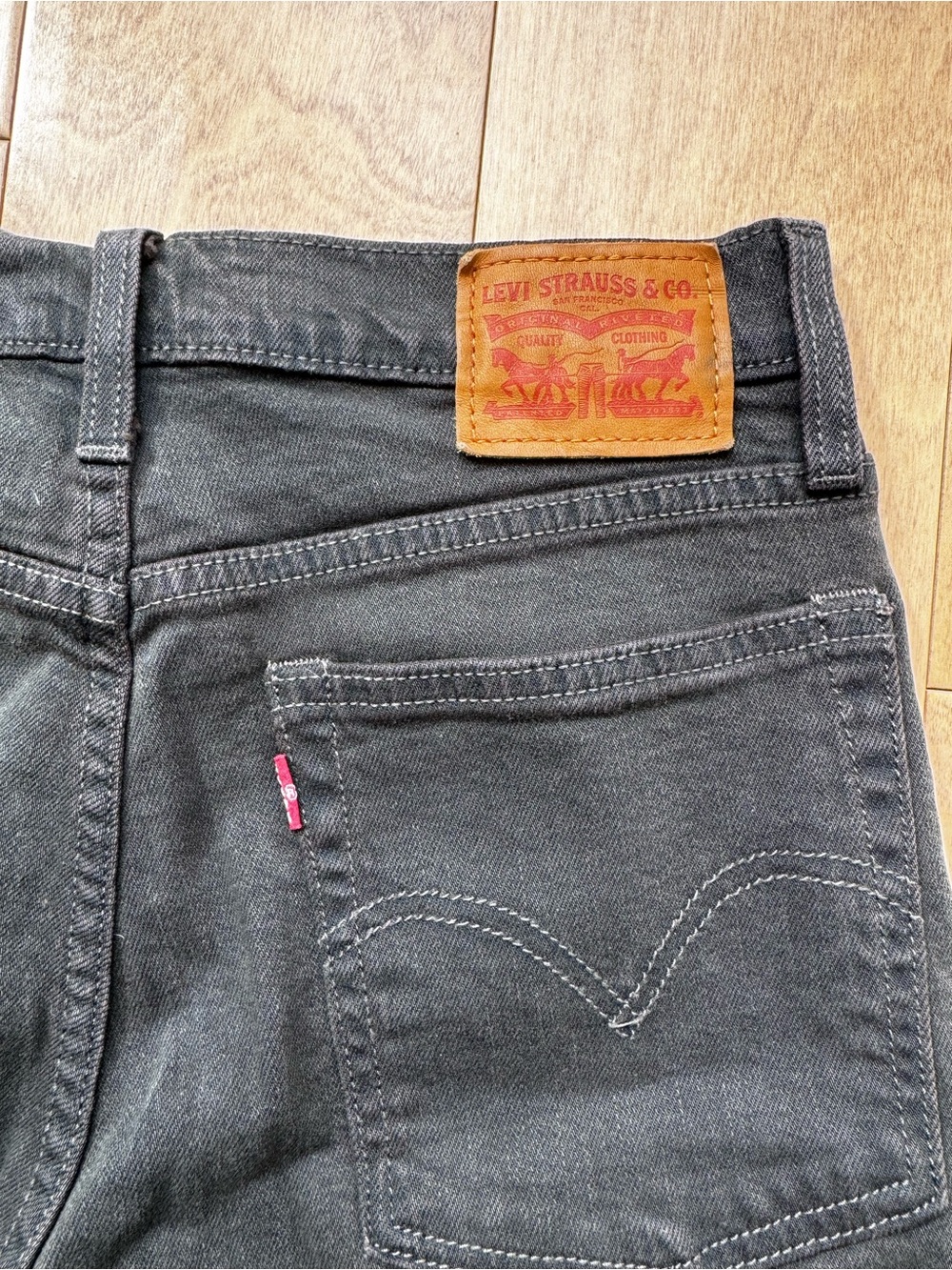 Levi's Women's High Rise Black Denim Jeans with Tan Patch
